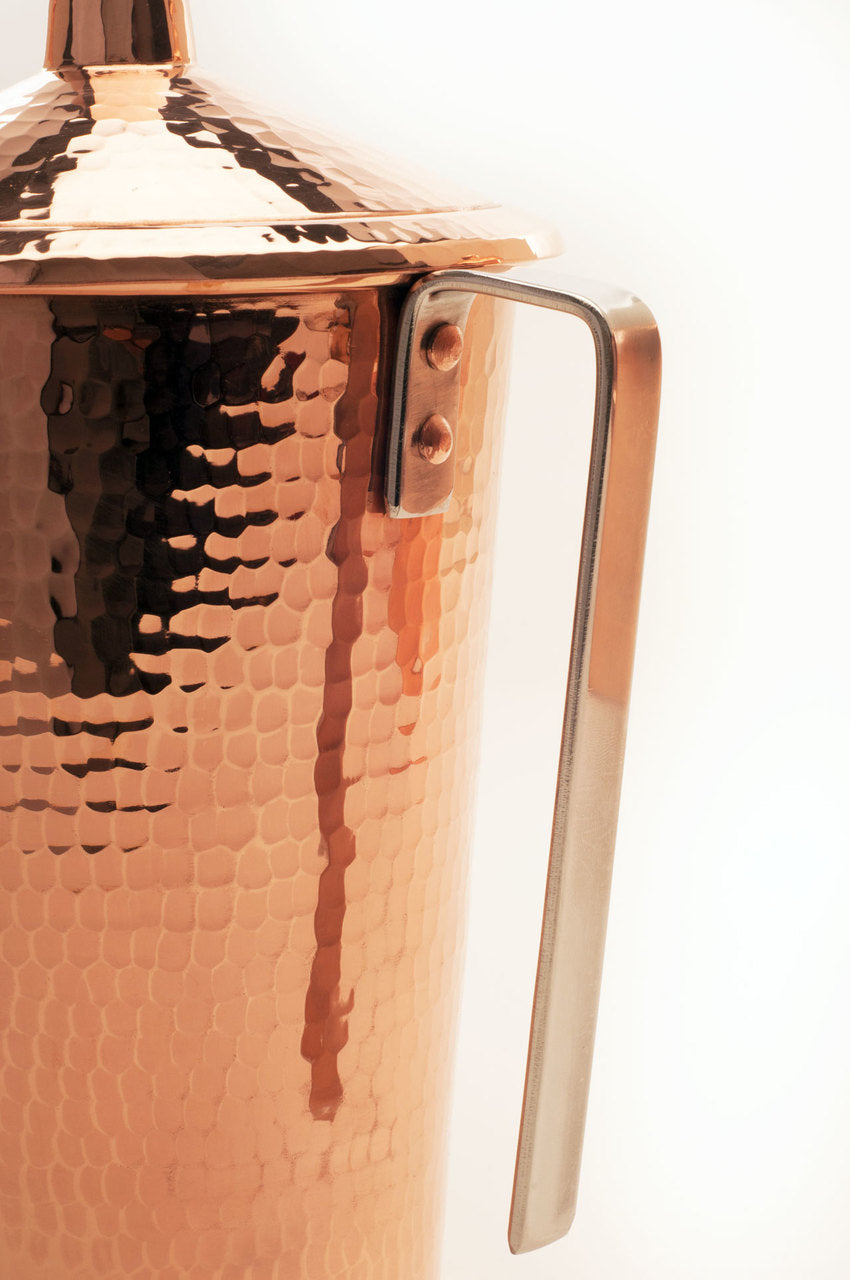 Hammered copper pitcher handle detail